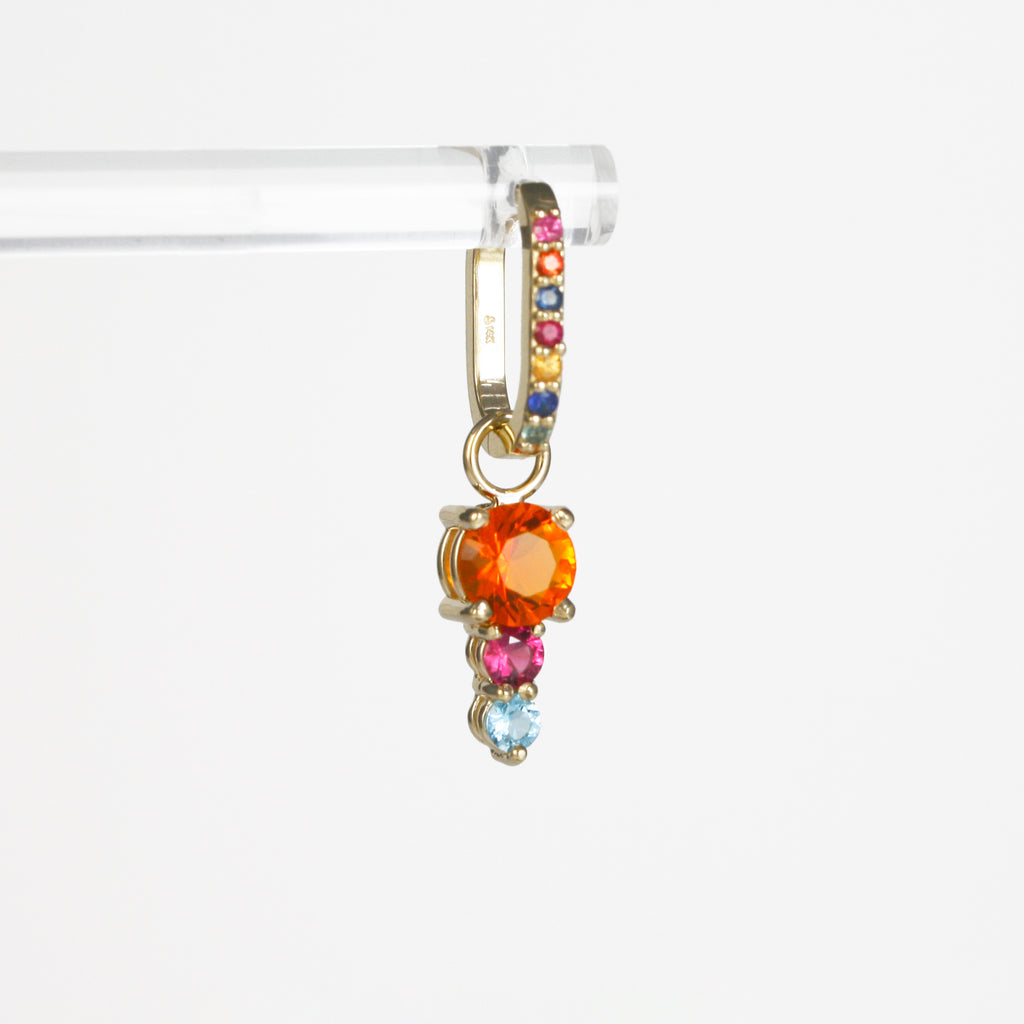 Fire Opal beautifully contrasted by a lively Ruby and Blue Topaz and Amethyst.