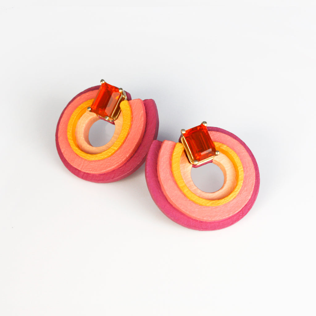 Inspired by the Universe and its infinite mysteries, these exquisite one-of-a-kind earrings are carefully made by hand, with attention to every step of the process. They consist of black walnut, which is treated to make it stronger and more resistant, and delicately hand-painted with top-quality acrylic paint. Mexican orange crystal opals are set in 14k yellow gold, making them eye-catching and unique.