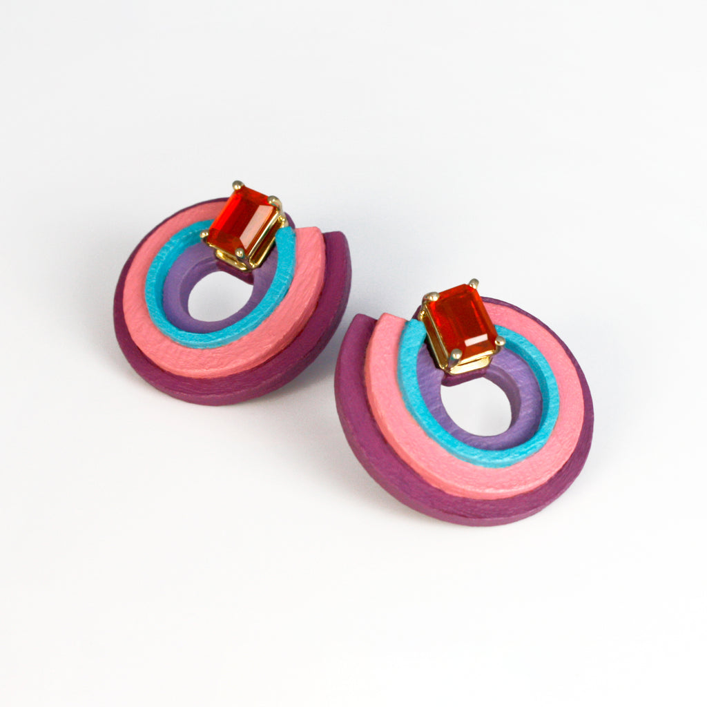 Inspired by the Universe and its infinite mysteries, these exquisite one-of-a-kind earrings are carefully made by hand, with attention to every step of the process. They consist of black walnut, which is treated to make it stronger and more resistant, and delicately hand-painted with top-quality acrylic paint. Mexican orange crystal opals are set in 14k yellow gold, making them eye-catching and unique.