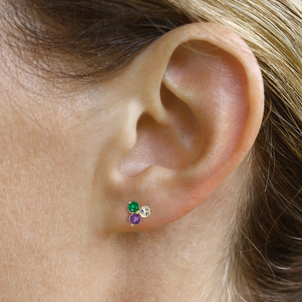 A delicate and playful trio of Mexican crystal opal, emerald and amethyst set in 14k yellow gold.