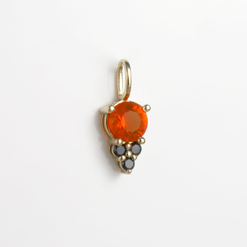 Add a touch of delicate black sparkles to your outfit with this 14k charm featuring a vibrant Mexican fire opal alongside three black diamonds.