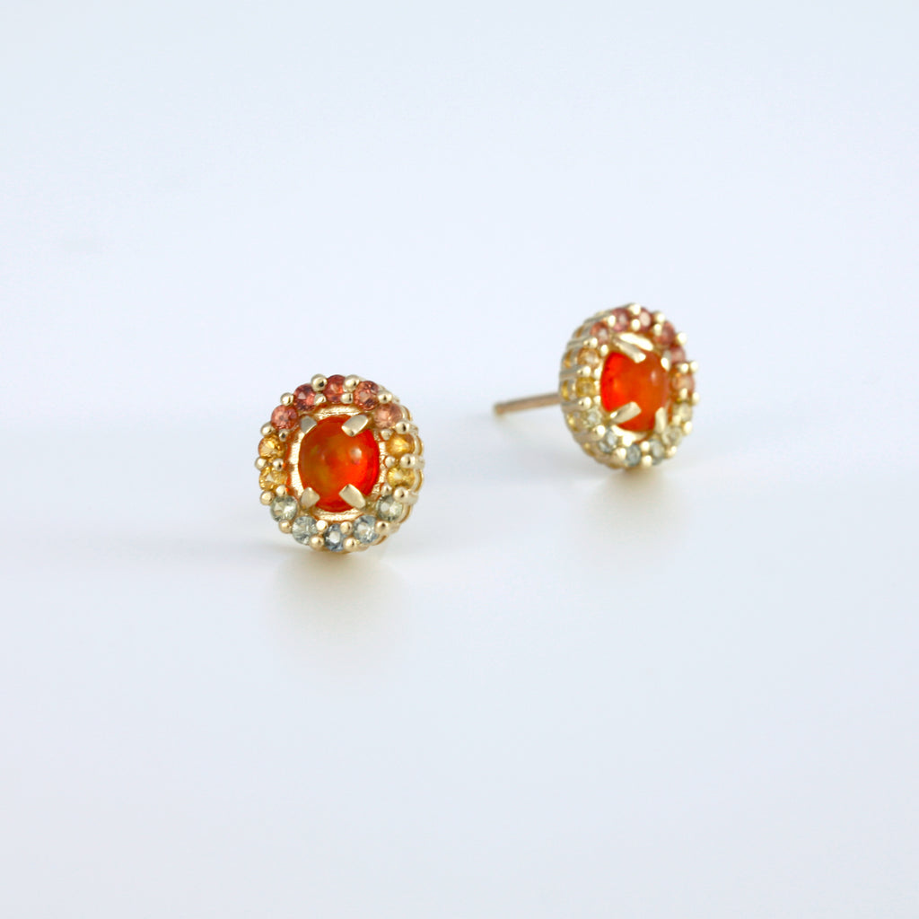Dainty tonal studs with Mexican orange crystal opal and sapphires.