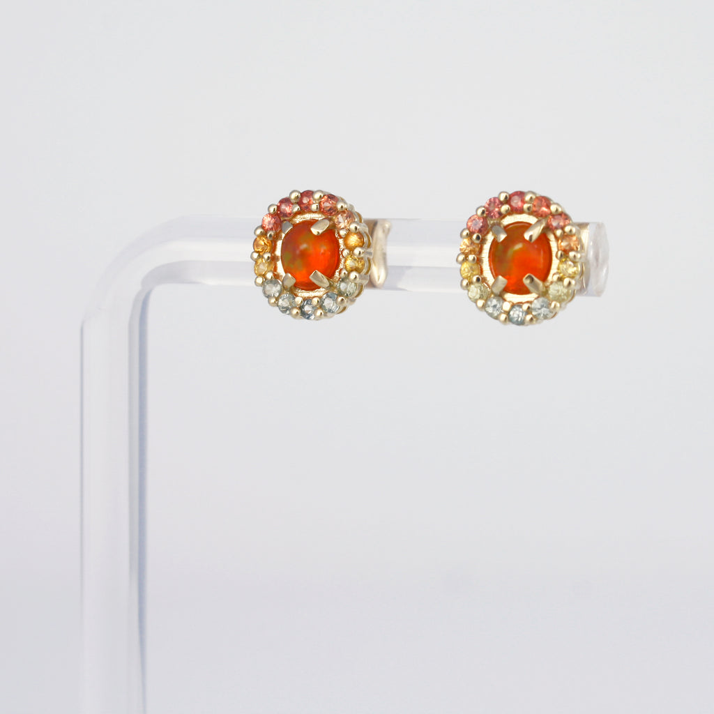 Dainty tonal studs with Mexican orange crystal opal and sapphires.