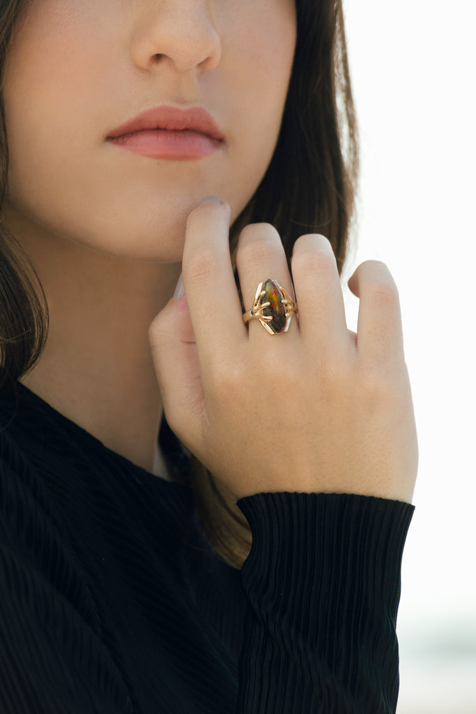 Mexican boulder crystal opal and black diamond ring set in 14k yellow gold.