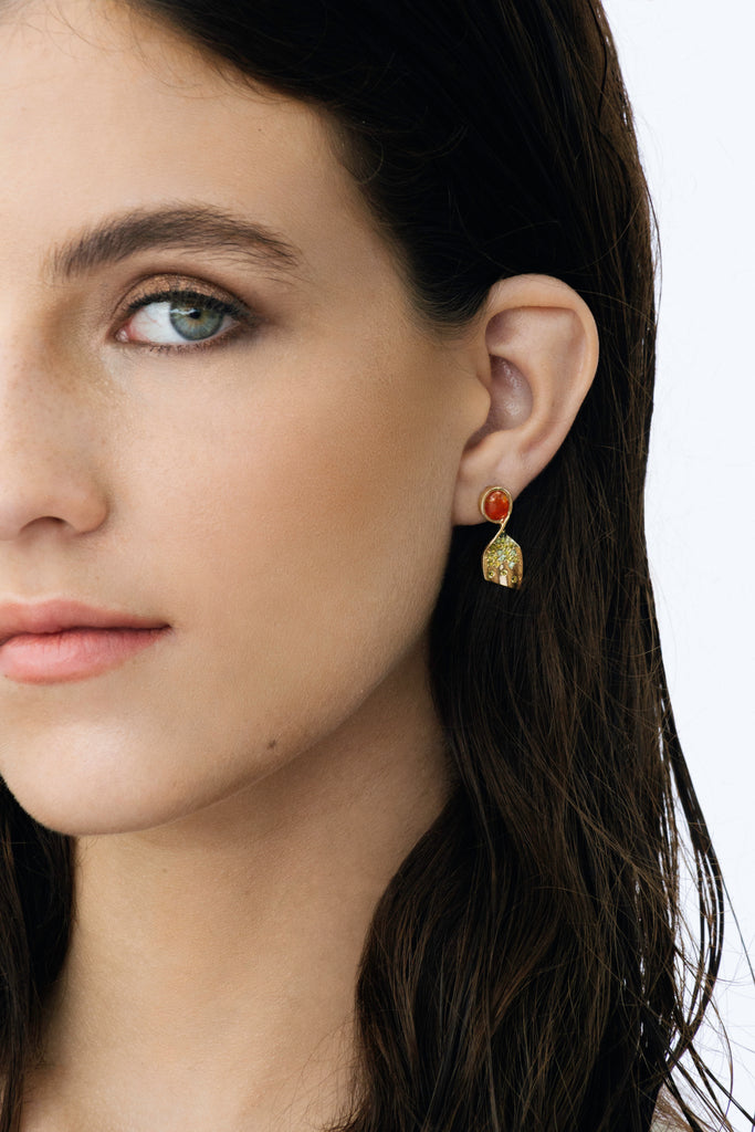 Vibrant Mexican orange crystal opal and a sprinkle of tourmalines set in a pair of 14k gold earrings that twist and turn in a unique way. 