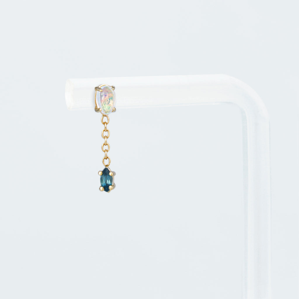 Vibrant tourmaline anchored by a chain to a Mexican crystal multicolored opal. Delicate and femme.