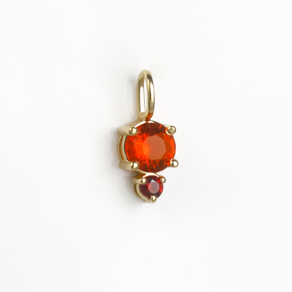 Vibrant red-orange Mexican fire opal alongside a lively ruby.