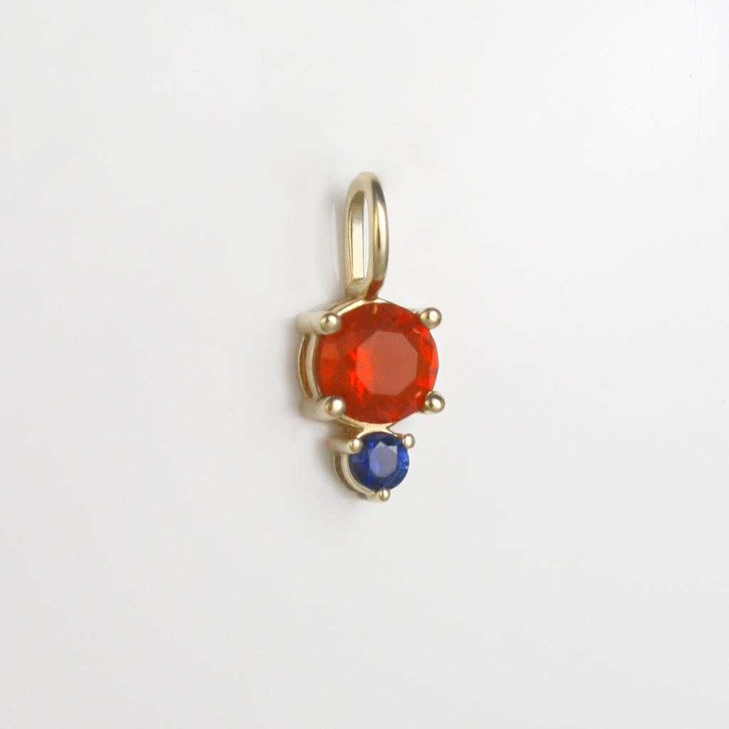 Vibrant red-orange Mexican fire opal alongside a lively sapphire.