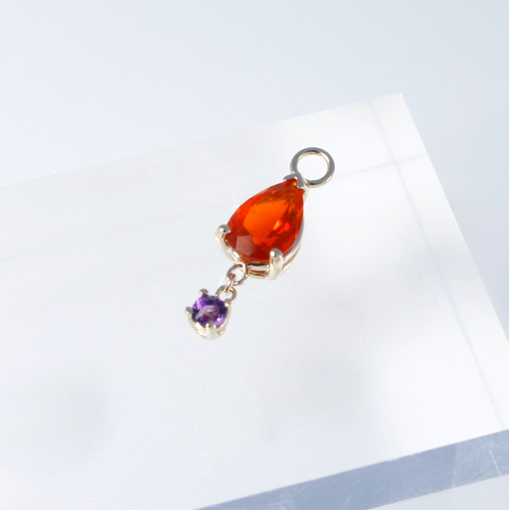 Earring charm featuring a vibrant Mexican fire opal linked by a chain to a contrasting amethyst.